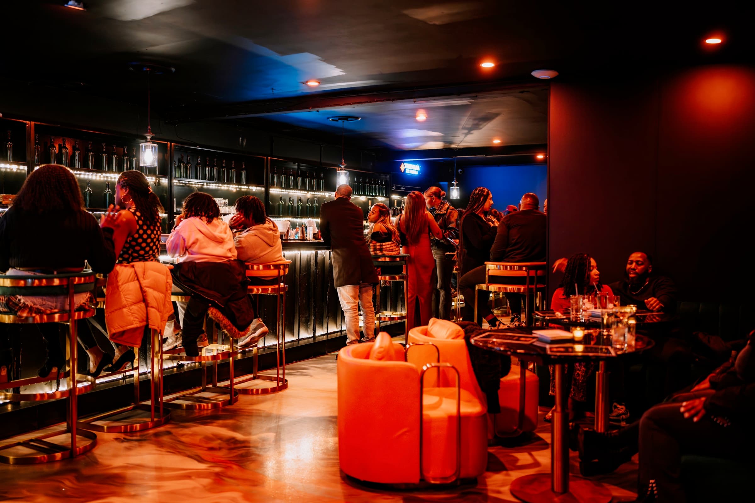 Guests gathered around the bar inside Privé Chicago
